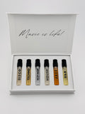Set of six small bottles labeled with music genres in a box with 'Music is Life!' text.